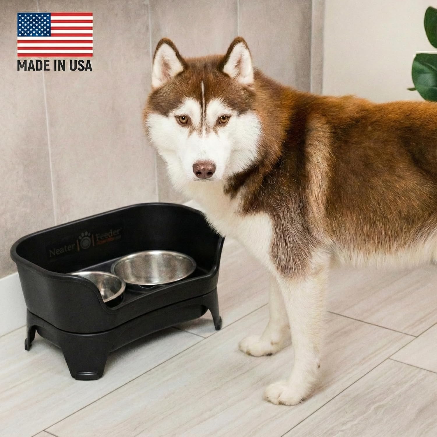 Black elevated dog feeder station with stainless steel bowls for medium to large breeds — side